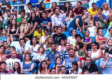 Odessa, Ukraine - June 25, 2016: Large Crowd Of Spectators Having Fun At Stadium, At A Concert Of Ukrainian Group Ocean Elzy During Creative Light And Music Show. Cheerful Bright Show In Party Club