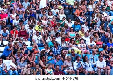 Odessa, Ukraine - June 25, 2016: A Large Crowd Of Spectators Having Fun At Stadium, At Concert Of Ukrainian Group Ocean Elzy During Creative Light And Music Show. Cheerful Bright Show In Party Club