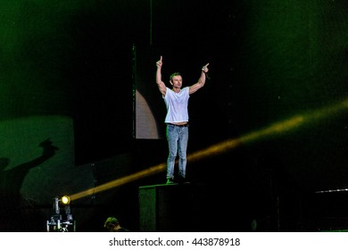 Odessa, Ukraine - June 25, 2016: Large crowd of spectators having fun at stadium, at concert of Ukrainian group Ocean Elzy during creative light and music show. Cheerful bright show in party club - Shutterstock ID 443878918