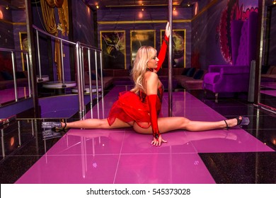 ODESSA, UKRAINE - June 6, 2015: Striptease bar. Young sexy girl in strip club luring visitors to the lap dance.  striptease clubs are gaining popularity in a period of crisis in the country