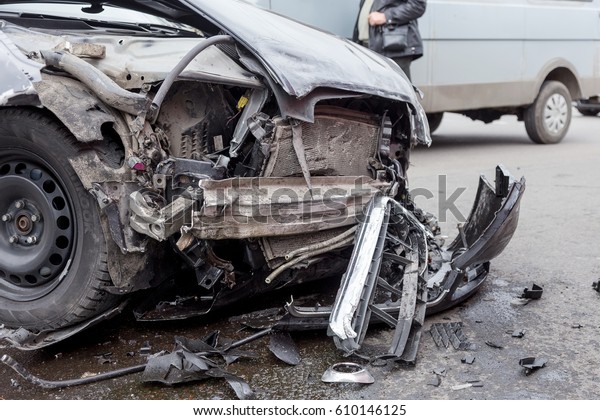 ODESSA, UKRAINE -\
MARCH 27, 2017: Car accident in city center. Broken car, the engine\
oil leaked, wheel burst.\
