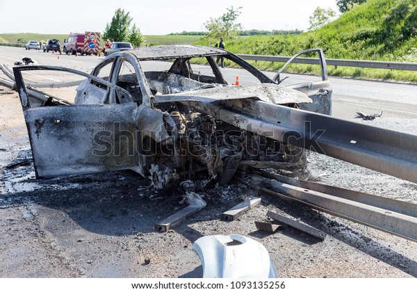 ODESSA, UKRAINE - May 17, 2018: accident on
high-speed road. Car at high speed drove to road guard and burned.
Terrible tragic accident due to speeding. Auto crashed into
separating road safety
guard