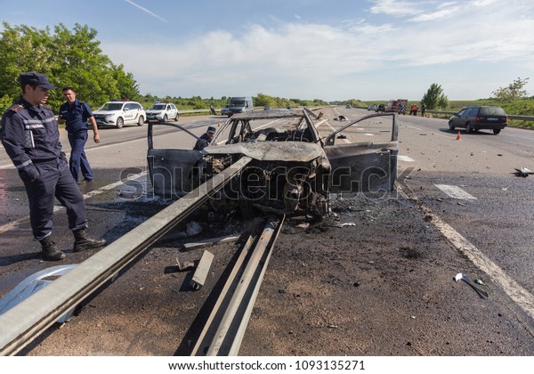 ODESSA, UKRAINE - May 17, 2018: accident on
high-speed road. Car at high speed drove to road guard and burned.
Terrible tragic accident due to speeding. Auto crashed into
separating road safety
guard