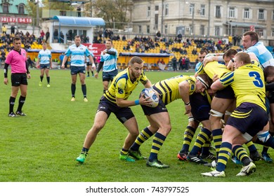 ODESSA, UKRAINE - May 21, 2017: European Rugby Champions Cup UKRAINE (blue) And Sweden (yellow). Rugby Ball On Field. Rugby Match Is A Heavy Fight For Ball. Rugby Players On Field