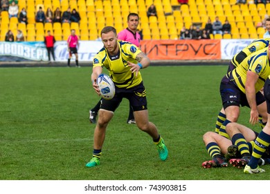 ODESSA, UKRAINE - May 21, 2017: European Rugby Champions Cup UKRAINE (blue) And Sweden (yellow). Rugby Ball On Field. Rugby Match Is A Heavy Fight For Ball. Rugby Players On Field