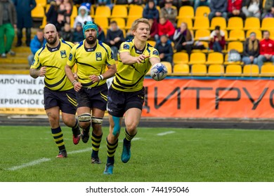 ODESSA, UKRAINE - May 21, 2017: European Rugby Champions Cup UKRAINE (blue) And Sweden (yellow). Rugby Ball On Field. Rugby Match Is A Heavy Fight For Ball. Rugby Players On Field