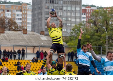 ODESSA, UKRAINE - May 21, 2017: European Rugby Champions Cup UKRAINE (blue) And Sweden (yellow). Rugby Ball On Field. Rugby Match Is A Heavy Fight For Ball. Rugby Players On Field