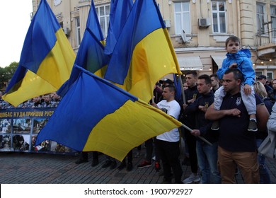 Odessa, Ukraine
May, 2.2019
Ukrainian patriots hold flags of Ukraine and sing the national anthem - Shutterstock ID 1900792927