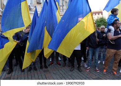 Odessa, Ukraine
May, 2.2019
Ukrainian patriots hold flags of Ukraine and sing the national anthem - Shutterstock ID 1900792933