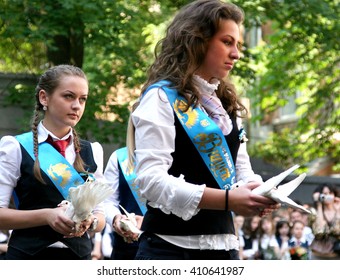 Odessa, Ukraine - May 28, 2010: Last Call For School Holidays In School Yard. Graduates Of Elementary Middle School Dance At The Ball And Release Of Doves Of Peace And Friendship.