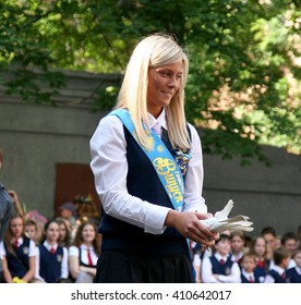 Odessa, Ukraine - May 28, 2010: Last Call For School Holidays In School Yard. Graduates Of Elementary Middle School Dance At The Ball And Release Of Doves Of Peace And Friendship.