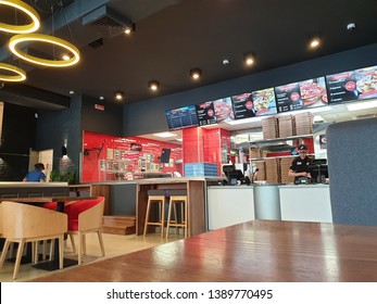 Odessa, Ukraine - May, 2019: Domino's Pizza Restaurant. View Of The Rack And Kitchen From The Client Table, Interior