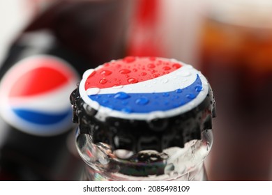 Odessa, Ukraine - September 23, 2021: Pepsi bottle with water drops, close up and selective focus.