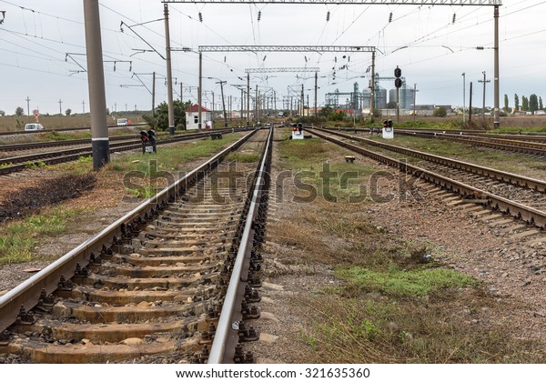 Odessa, Ukraine -\
September 28 2015: The movement of freight trains on the Ukrainian\
railways. railway interchange. Signs on the railway. Railway\
traffic lights. Change the\
way.