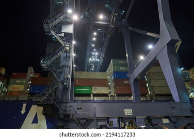 Odessa, Ukraine SIRCA 2019: Container Ship At Port Terminal. Containers Loading By Crane In Night , Trade Port. Container Operation In Port Series