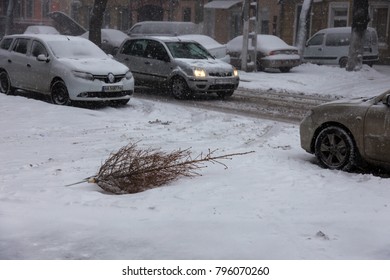 ODESSA, UKRAINE-January 16, 2018: Strong snowfall, cyclone in city streets in winter. Cars are covered with snow. Slippery road. Bad weather in winter: heavy snow and snowstorm. Pedestrians go on snow - Shutterstock ID 796070260