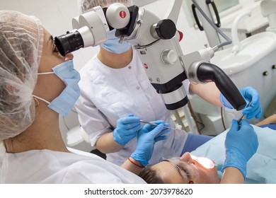 Odessa,Europe, Ukraine May, 20, 2020. Dental Treatment Under The Microscope, Women Dentist Treats Teeth Using A Microscope Dental Clinic 