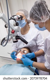 Odessa,Europe, Ukraine May, 20, 2020. Dental Treatment Under The Microscope, Women Dentist Treats Teeth Using A Microscope Dental Clinic 