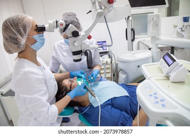 Odessa,Europe, Ukraine May, 20, 2020. Dental Treatment Under The Microscope, Women Dentist Treats Teeth Using A Microscope Dental Clinic 