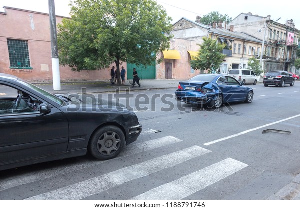 ODESSA,UKRAINE -09,24 2018: broken cars as result\
of traffic accident on pedestrian crossing. Accident. Road accident\
on marking of pedestrian crossing, car crash, collision, insurance\
case on highway