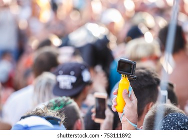 ODESSA,UKRAINE-26 AUGUST,2017:4k Action Video Camera GoPro On Yellow Stick.Operator Shoot? Hd Videos On Summer Music Festival.Concert Crowd On Background