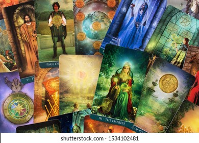 Odessa/Ukraine-September 25,2019:Tarot esoteric  reading cards divination with major empress arcana of Thelema tarot deck colorful background top table view