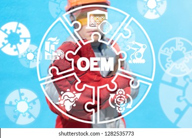 OEM - original equipment manufacturer industry concept. Worker offers a OEM abbreviation on a virtual screen.