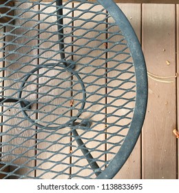 Off Center Small Wrought Iron Patio Table Seen From Above