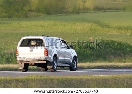 Off road capable SUV on quiet country route