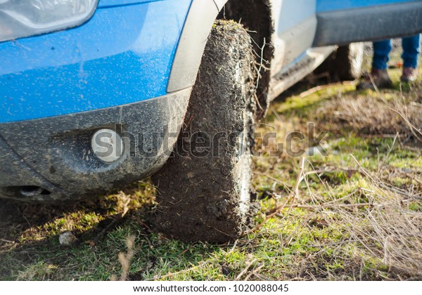 off road\
car full of dirt and mud. focus on the\
tire