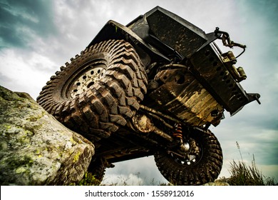 Off Road Car On Mountain Road. Car Tire. Tire For Offroad