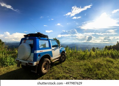 The  Off Road Car On The Top Of Mountain With Blue Sky
