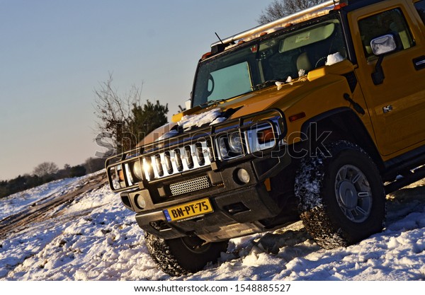 Off road car in the snow. Hummer H2.\
(Budel,\
Netherlands - 08/01/2015)