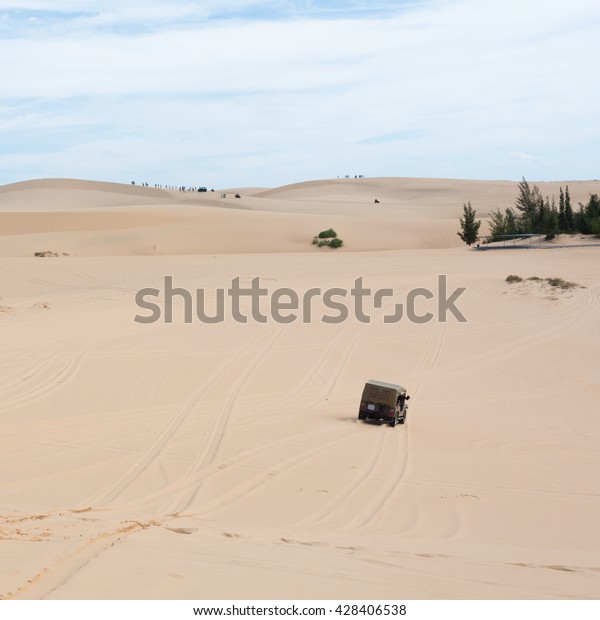 off road car vehicle in white sand dune desert at
Mui Ne, Vietnam