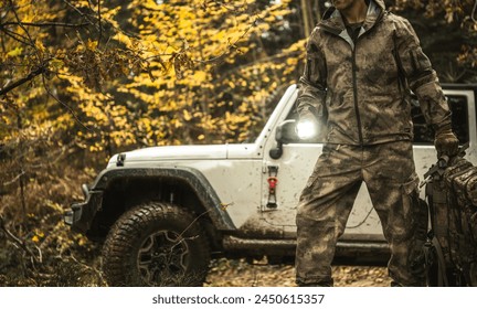 Off Road Expedition Theme with a Man Wearing Camouflage in Front of His SUV - Powered by Shutterstock