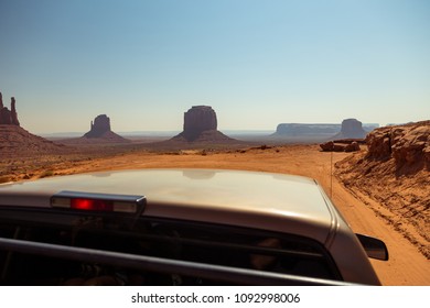 Off- Road On A Duty Road Through The Monument Valley. Tour To The Landmarks Of The Wild West USA. Navajo Tribal Park.