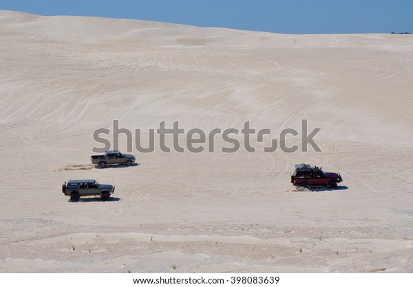 Off road recreation on the white sand dunes in\
Lancelin, Western Australia/Off\
Road/LANCELIN,WA,AUSTRALIA-SEPTEMBER 28,2015: Off road trucks\
racing the white dunes in Lancelin, Western\
Australia.