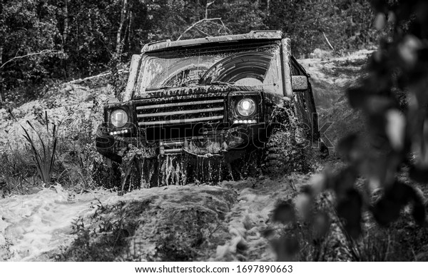 Off road sport truck between mountains
landscape. 4x4 travel trekking. Safari suv. Expedition offroader.
Tires in preparation for race. Rally
racing