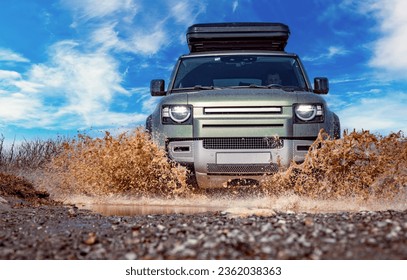 Off road tourist car rides off-road in the highlands. Expedition travel and vacation, adventures in remote areas. - Powered by Shutterstock