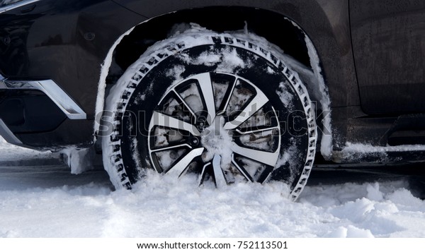 Off road\
winter tire packed with snow in deep\
snow\
