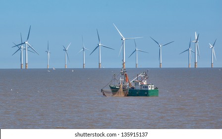 Off sure wind turbine and fishing boat