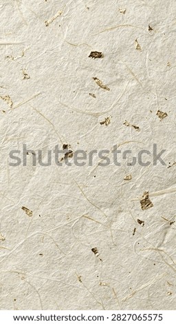 Off white handmade paper texture with gold flecks handmade background