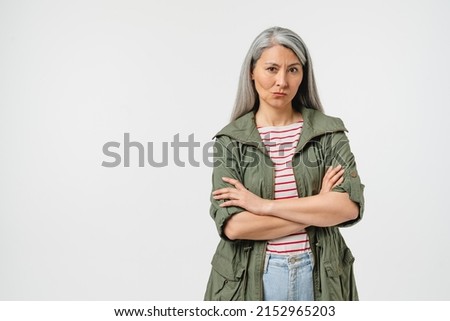 Offended angry sad caucasian mature middle-aged woman with grey hair blowing her lips feeling hurt isolated in white background. Sad bad news Foto stock © 