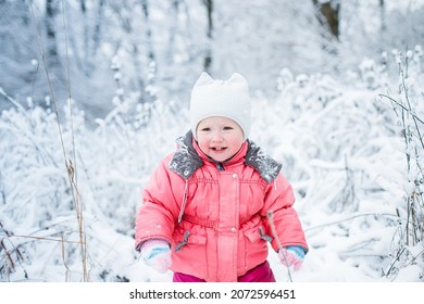 Offended Child Froze On A Walk In Snow-covered Park And Threw A Tantrum. Unhappy Kid In Uncomfortable Clothes After Active Games In The Winter. Soft Focus