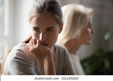 Offended Millennial Adult Daughter And Senior Mother Sit Aside Back To Back Avoid Talking After Fight, Hurt Stubborn Two Generations Of Women Ignore Each Other After Conflict, Misunderstanding Concept