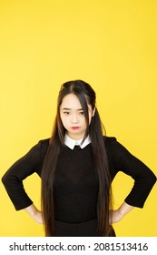 Offended Woman. Displeased Expression. Negative Emotion. Unhappy Frowning Upset Girl Isolated On Yellow Empty Space Studio Background.