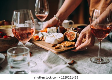 Offering appetizers at a friendly party. Dinner or aperitivo party concept.