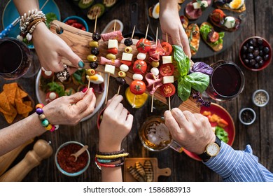 Offering and serving tapas to many people hands , offering concept with many kinds of tapas
 - Powered by Shutterstock