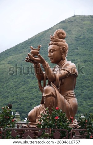 The Offering of the Six Devas : one of the six bronze Devas surrounding the Tian Tan Buddha, at the very top of the staircase on Lantau Island, China