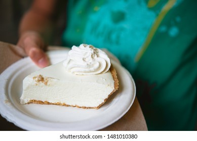 Offering A Slice Of Key Lime Pie,traditional American Dessert From The Florida Keys